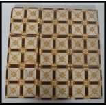 A set of nine 19th century Victorian encaustic ceramic tiles by Campbell. Measures 15.5 cm wide