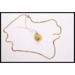 A 9ct gold box link necklace chain (af) having a replacement clasp. Weighs 9 grams. Along with a