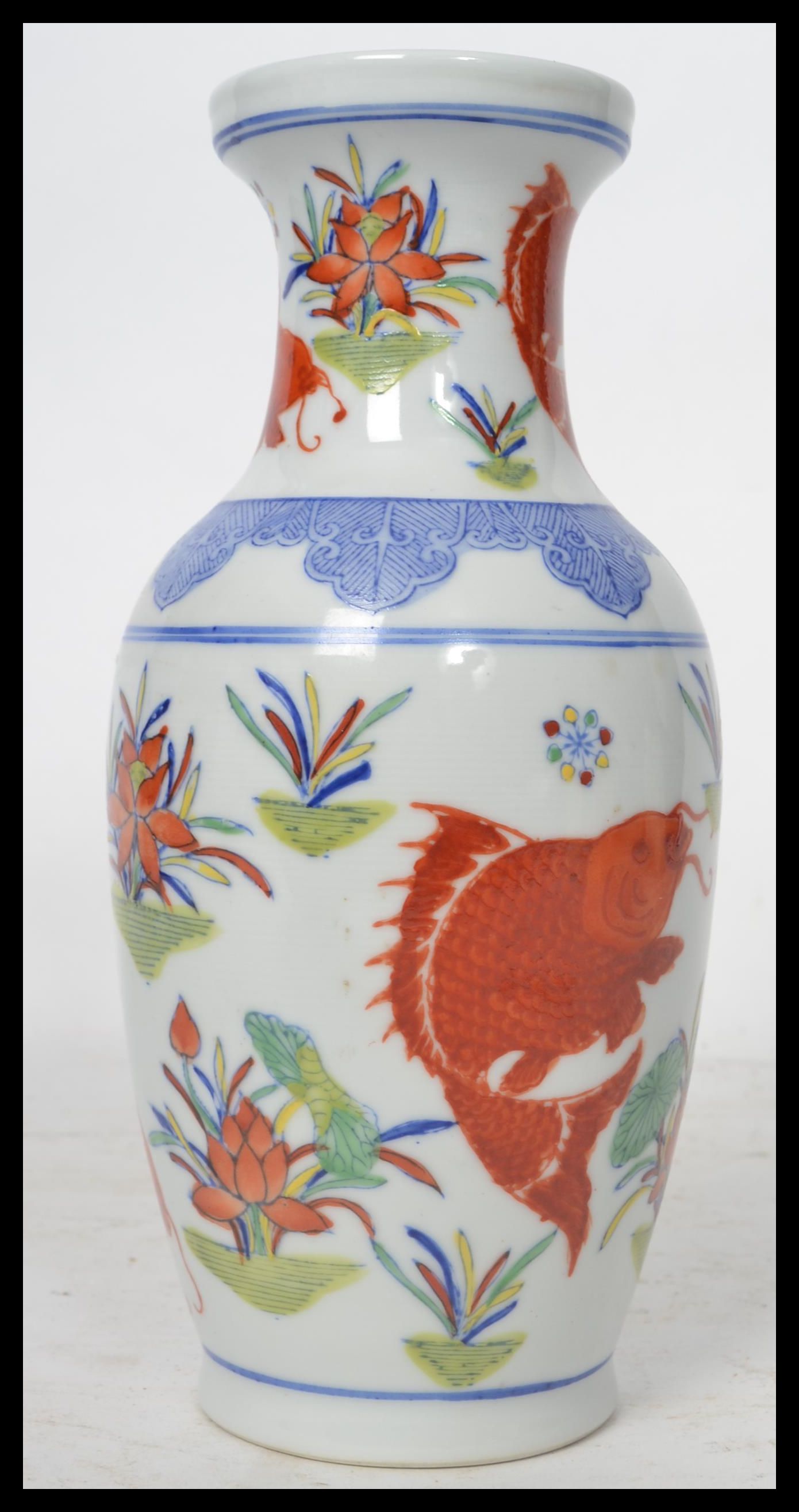 A 20th century Chinese vase decorated with scenes of carp and weeds with ochre red character marks - Image 2 of 6