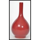 A 19th century Chinese monochrome baluster vase having a red glaze. The vase of baluster form having