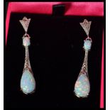 A pair of silver marcasite and opal drop earrings in the art deco style. Complete in presentation