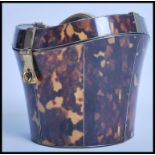 An unusual faux tortoiseshell tea caddy in the for