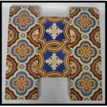 A group of eight 19th century Victorian ceramic encaustic floor tiles by Godwin tiles. Six