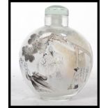 A 20th century Oriental Chinese glass perfume scent bottle depicting elders and a sweeping child
