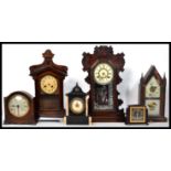 A collection of vintage and antique mantel clocks dating from the 19th century to include
