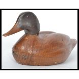 A vintage 20th century finely carved decoy Mallard Hen duck with inset glass eyes. Measures 27 cm