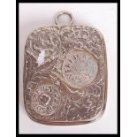 A 19th century Victorian silver plated sovereign coin holder having a scrolled design with bail loop