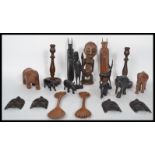 A large collection of African hardwood carved animals made of ebony and hardwoods comprising of