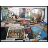 A collection of vinyl long play records dating from the 1960s featuring various artists to include