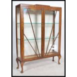 A vintage 20th century 1930's  Art Deco china display cabinet raised on cabriole legs with