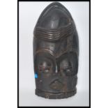 A late 19th century early 20th century large hand carved wooden tribal ceremonial  Mask