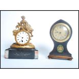 Two clock one being an early 20th century Edwardia