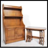 An Ercol Windsor golden dawn elm and beech nest of three  tables, largest table: length 63.6cm,