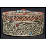 A vintage 20th century white metal / silver gilt and Turquoise trinket pot / box of circular form,