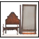 A 1930's Queen Anne Walnut Heals & Co single bed having tall shaped headboard with double pair