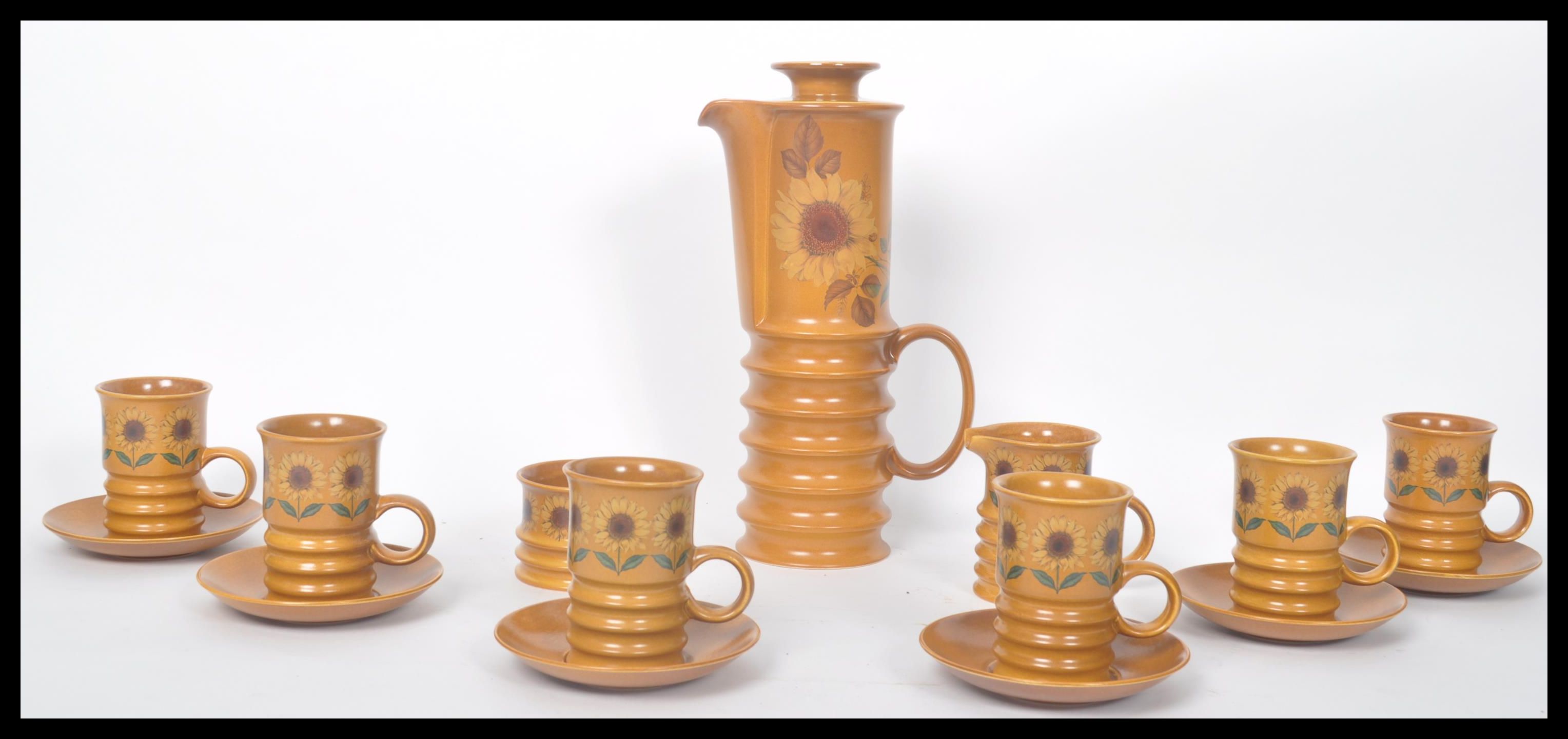 A vintage retro 20th century Carlton Ware coffee service in the Sunflower pattern. The earthenware