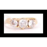 A hallmarked 22ct gold three stone ring.  Set with three white stones. Hallmarked Birmingham. Weight