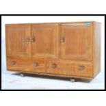 Ercol - Windsor - A 1960's retro vintage beech and elm sideboard comprising of a set of three