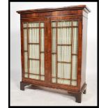 A 19th century Victorian mahogany astral glazed linen backed two door library  bookcase. The