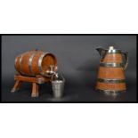 A 19th century water jug and brandy barrel in the form of coopered barrels having silver plated