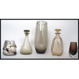 A collection of Whitefriars studio glass to include a tall bubble control vase, two decanters with