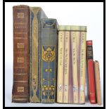 A collection of vintage and antique books dating from the early 129th century to include three books