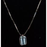 A 18ct white gold box link necklace chain having a faceted aquamarine pendant. Complete in