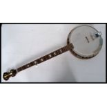 A beautiful original c1970's Banjo made by Kay . Five stringed instrument, with 12" resonator.