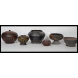 A collection of six vintage early 20th Century and older Chinese wooden turned lacquered pots,