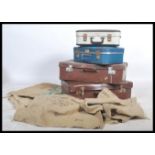 A stack of vintage / retro suitcases to include flight cases for British Airways and BEA