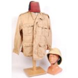 20TH CENTURY MILITARY STYLE PITH HELMET, TUNIC AND FEZ