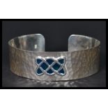 A sterling silver arts and crafts style bangle bra