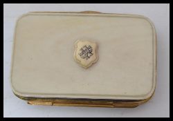 A vintage 19th century ivory and gilt metal purse