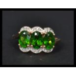 A 14ct gold ring having three tourmaline central p