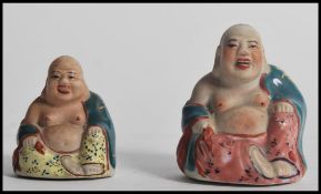 Two Chinese miniature ceramic laughing Buddha's ha