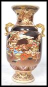 A 19th century Japanese Kutani vase having twin el