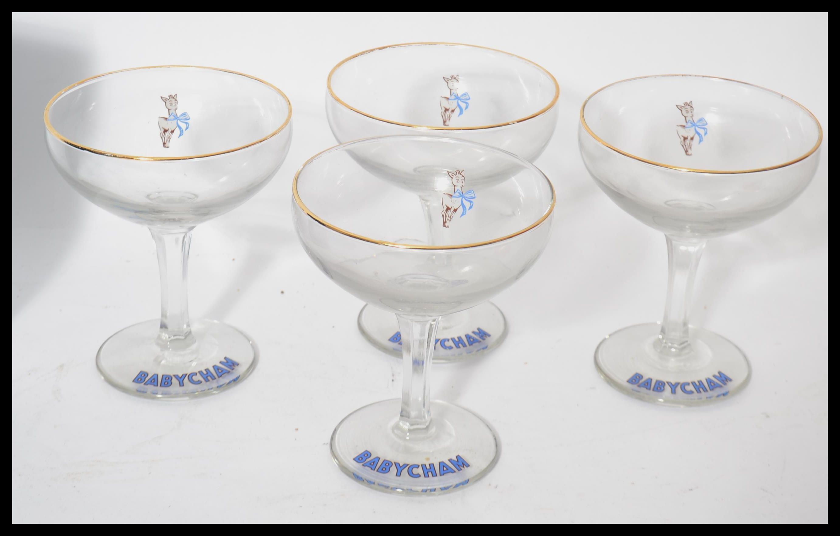 A set of four vintage 20th century Babycham white - Image 4 of 4