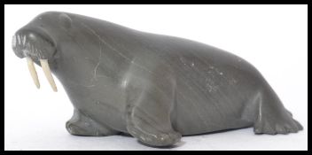 An Inuit / Eskimo soapstone carving of a walrus wi