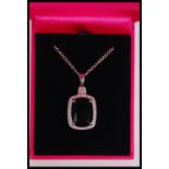 A silver and CZ faux emerald pendant necklace havi