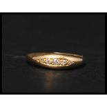 An antique 18ct gold and five stone diamond ring s