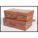 A good early 20th century leather suitcase with re