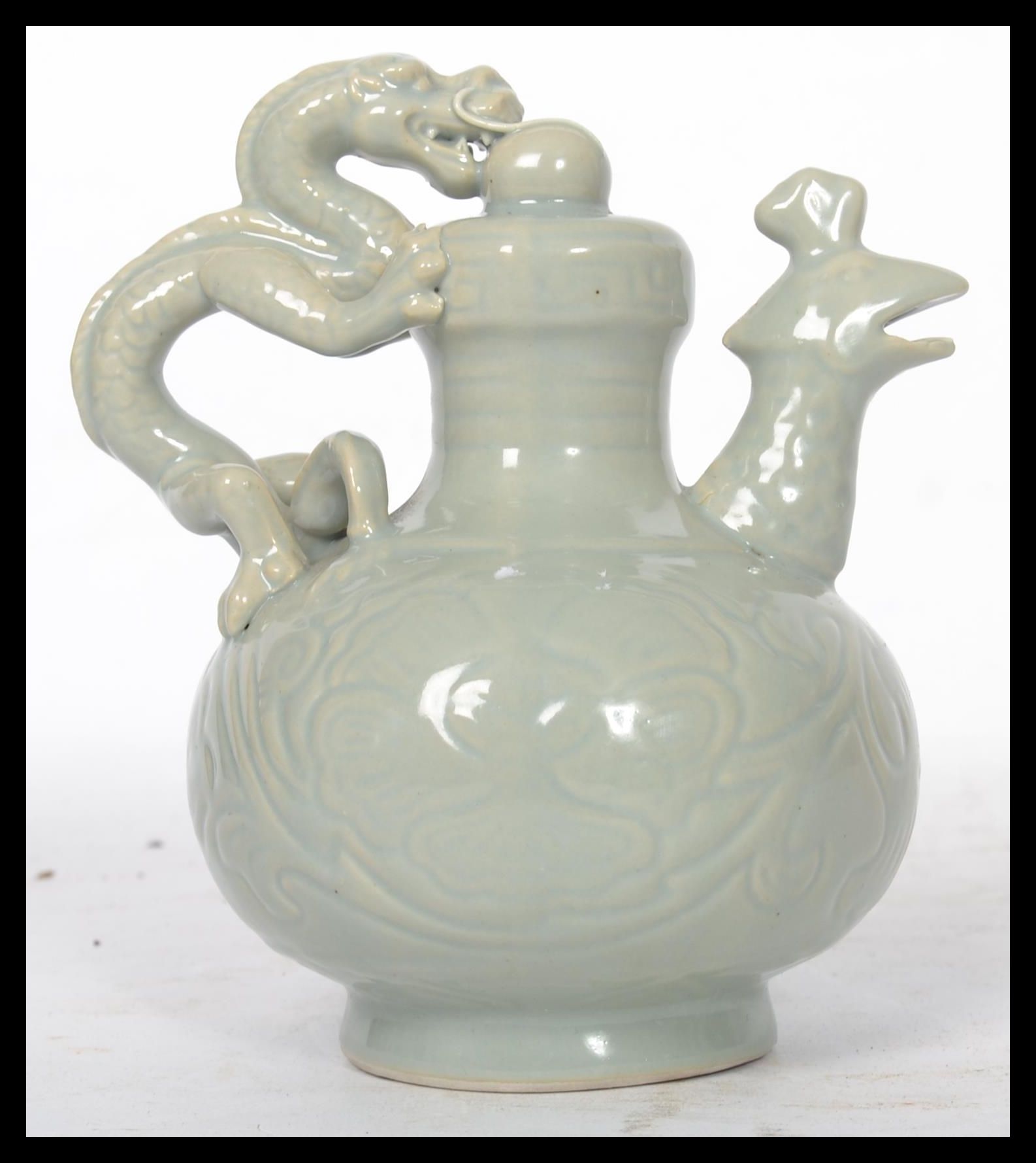 A 20th century Chinese teapot having a green drago