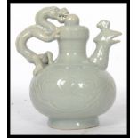 A 20th century Chinese teapot having a green drago