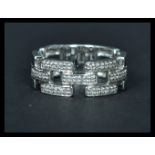 An 18ct white gold ring having interlocking sectio