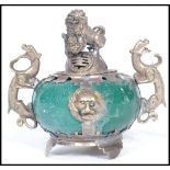 An early 20th century silver plated  incense pot of bulbous form having a green jade type stone body