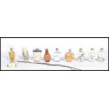 A group of ten Oriental Chinese perfume scent bottles of varying form and patterns. To include