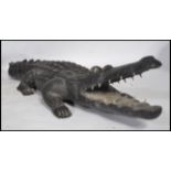 A fantastically carved 20th century tribal carving of a Crocodile possibly Polynesian in origin,