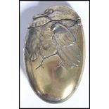 A vintage early 20th century silver plated match vesta in the form of a hatching bird, hinged