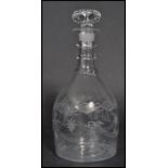 A 19th century Georgian hand blown cut glass decanter having an engraved body. The decanter of