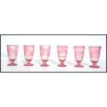 A set of six 19th century hunting theme Victorian Bohemian cut glass goblets. The cranberry glass